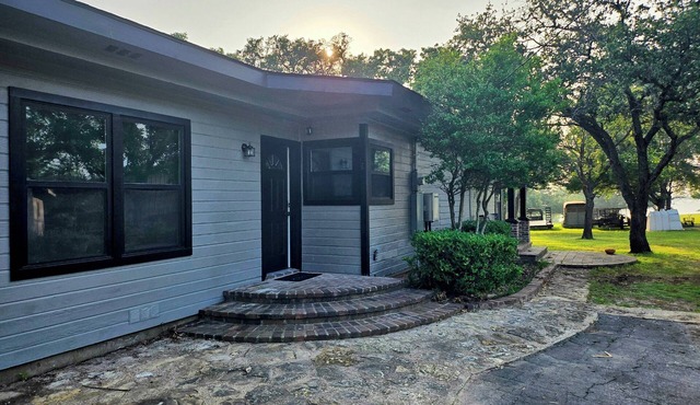 Newly Renovated 1.5 Acre Lake Front Home with Game Room and Direct Lake Access.