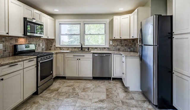 Newly Renovated 4 bedroom home W/big yard and driveway