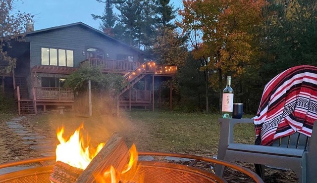 Newly renovated Lake Side Leisure with boat dock, fire pit, and updated decor in a modern lake home