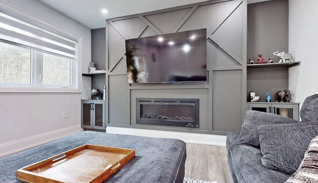 Newly renovated luxury Home with deck, surrounded by trees on a 5 acres land