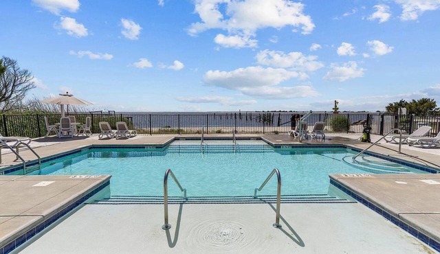 No Cleaning Fee! Brand New Double Queen Studio Condo w/Waterfront Pool + Beach