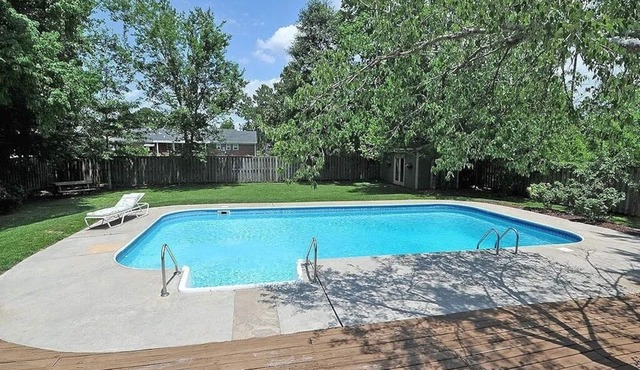 Oasis in the middle of town for large groups with pool and 2 Master bedrooms.