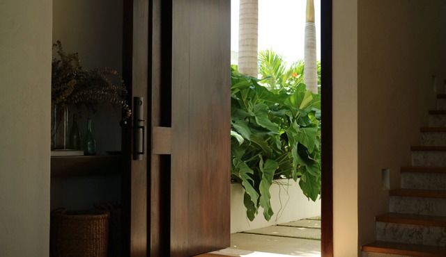 OCEAN ELEVEN marina villa with boat and ocean view.