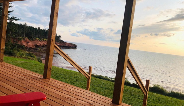 Ocean-front cottage on private, treed lot.