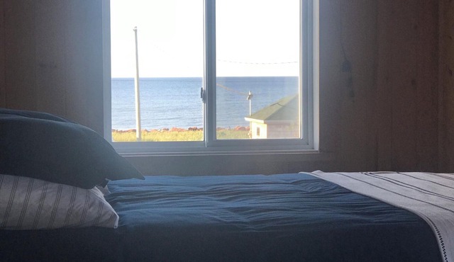 Ocean view cottage, steps from beautiful north shore beach.