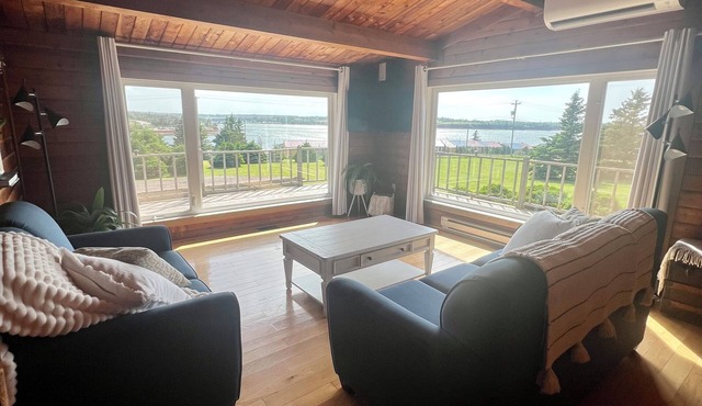 Ocean view cottage with a perfect wrap around deck to watch beautiful sunsets.