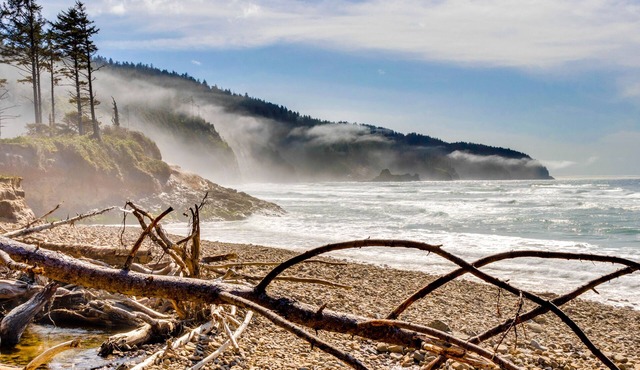 Ocean-view home overlooking Netarts Bay with deck & hot tub