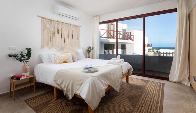 Ocean Views from every room! Modern Condo near the beach. No cleaning Fees!