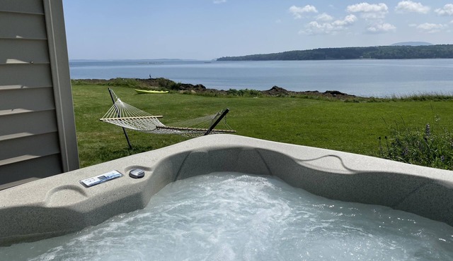 Oceanfront cabin with private beach and hot tub