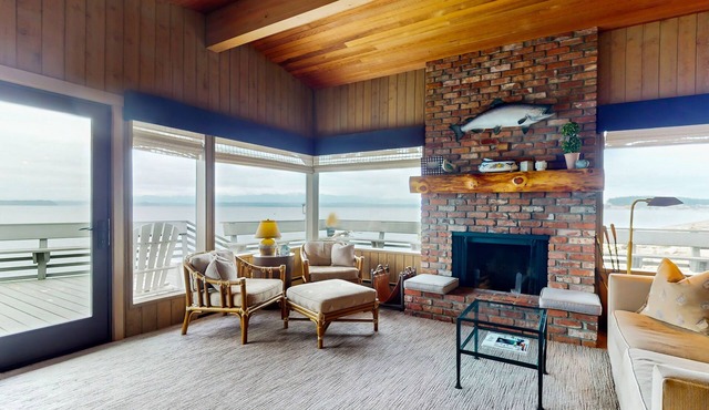 Oceanfront home with ocean views, beach access, large deck, fireplace, & W/D