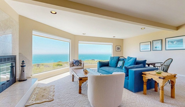 Oceanfront house with shared pool, private hot tub, modern decor, & meadow views