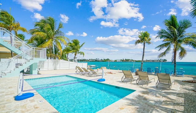 Oceanfront PARADISE w Heated pool, 55’ dock, ocean view & bathroom in every room