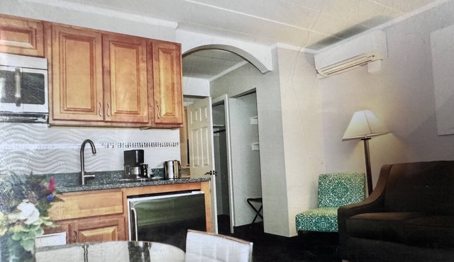 Oceanfront Property Suite Kitchenette with a Private Bedroom and a Queen Bed