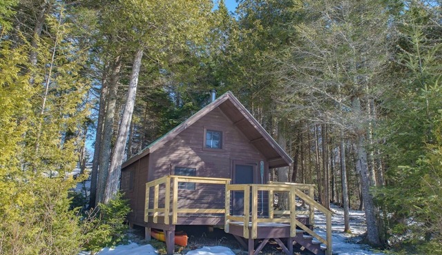 Off grid home with a cabin on a private lake