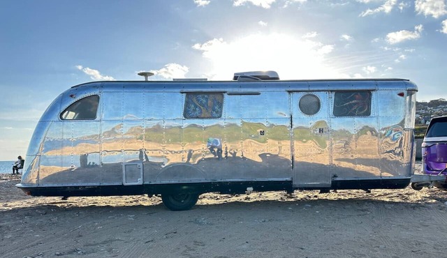 Off-grid trailer stay with valley views and dark skies