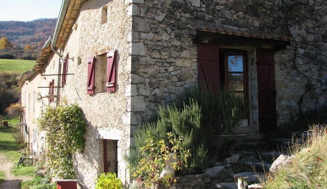 Old farm house in hamlet “Les Granges” with view across fields and mountains