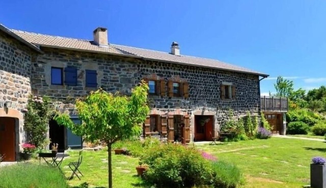 Old farm with covered terrace at the foot of Pic du Lizieux