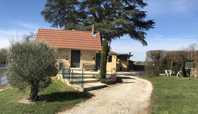 Old fisherman's cottage renovated on the banks of the river sure beautiful closed ground.