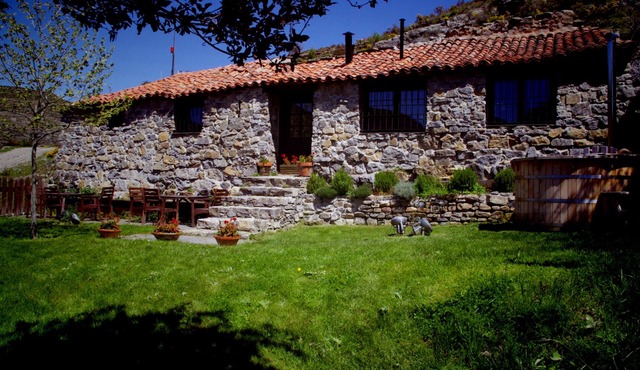Old house in the mountain made of stone, rock and wood. Private garden and barbecue