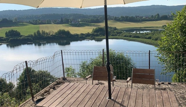 Old Jura farmhouse with panoramic view of Lac de l'Abbaye