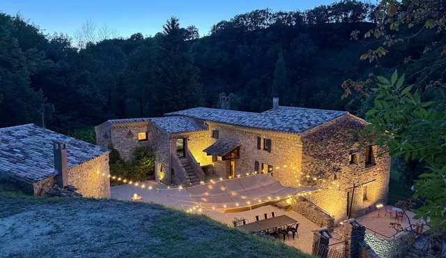 Old mill nestled in greenery in Drôme Provençale, hidden from view