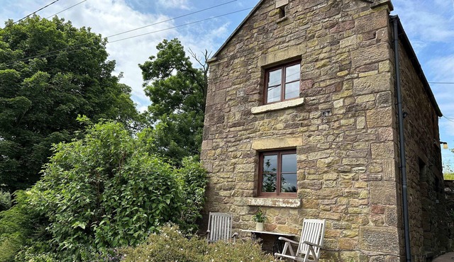 OLD POST OFFICE BARN, with a garden in Leek