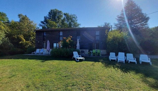 Old tobacco barn with a view of the Dordogne