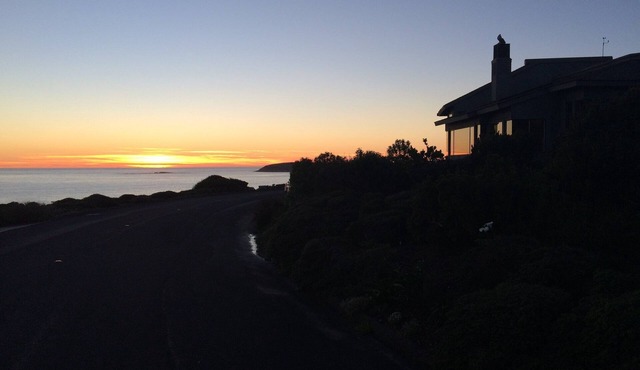 ON A BLUFF WITH 180 DEGREE CLOSE WATER VIEWS SHORT WALK TO THE BEACH