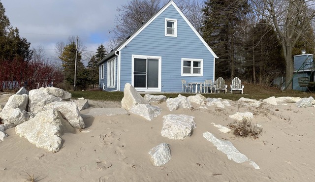 On the Shores of Lake Michigan with Breathtaking Views & A Beach Out Your Door!