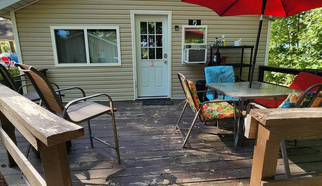 One Bedroom Cabin - Lakeview - Charming 500 sq ft one-bedroom cabin located at Outrigger Resort, just 1/4 mile from Indiana Beach Amustment Park! Features a lake view, private bathroom, kitchen, and living room. One (1) queen bed and one (1) futon al