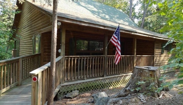 One bedroom, one bath log-sided cottage with private hot tub on Lake Ouachita. by RedAwning