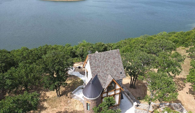 One of a kind Castle on picturesque Skiatook Lake with a Rapunzel exterior look