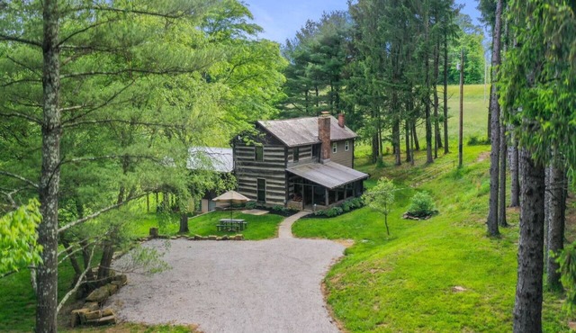 ONE OF A KIND HISTORIC LOG CABIN ON 10+ ACRES IN HOCKING HILLS