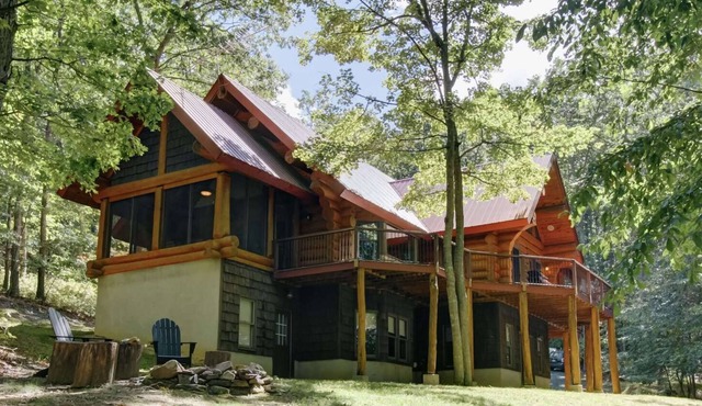 One of a Kind Log Home Tucked Away in the Woods!