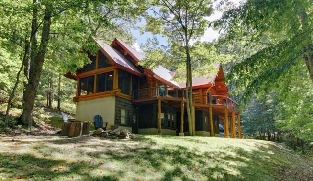 One of a Kind Log Home Tucked Away in the Woods!