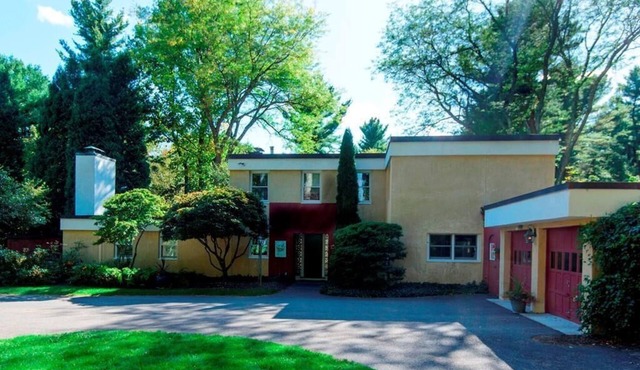 One -of-a kind mid-century Home estate set on 15 acres with gardens and a pool.