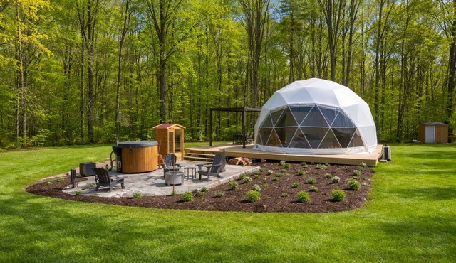 One of kind wellness/glamping experience with wellness amenities, covered outdoor dining, a complete live fire cooking setup, and a clear star gazing top.