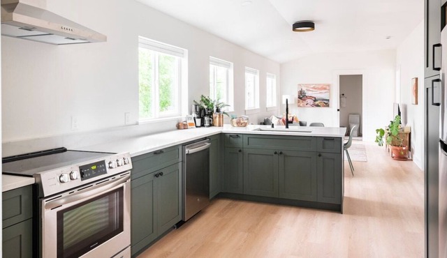 Oodles of light in modern home by historic Manito