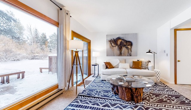 Open and inviting, two-story condo with full kitchen, patio, and wildlife views