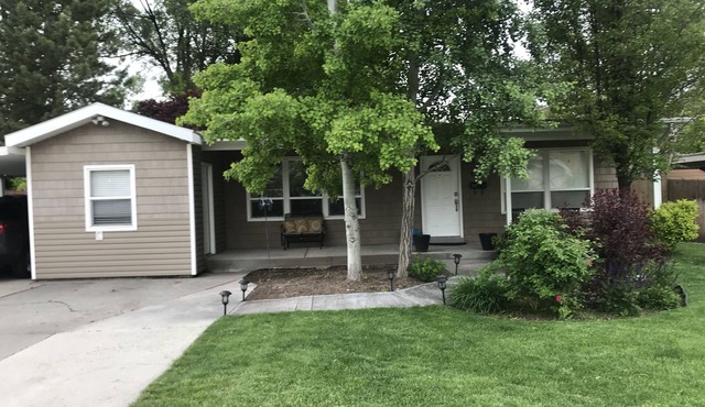 Open floor plan with a covered patio and fenced yard.