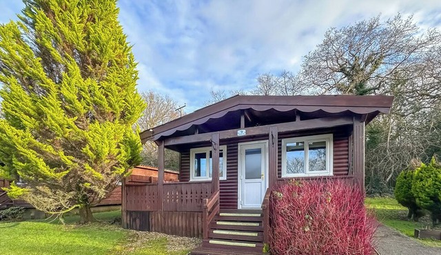 Open plan lodge with two doubles, both with TV/DVD.