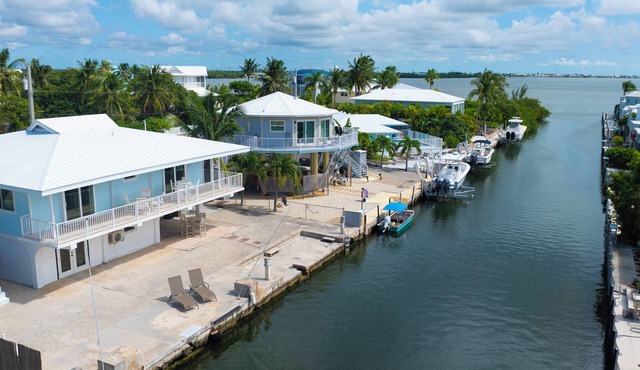 Open Water Views from this Modern Canal Home with Elevator & Easy Boating Access