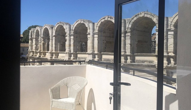 Opposite Les Arenes and La Major