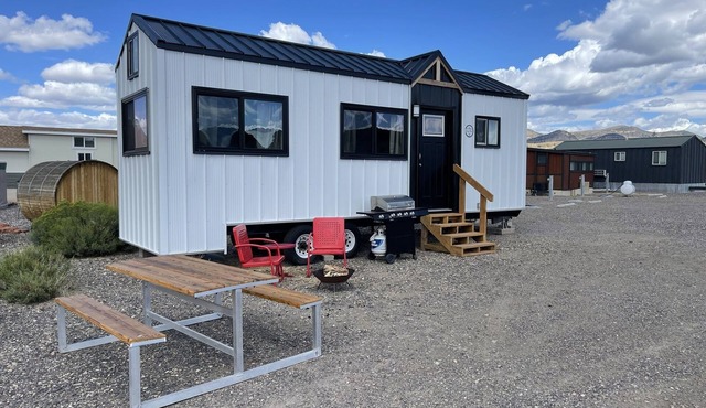 Our newest and one of our largest tiny homes contains a queen bed on the main level and two queen lofted beds. Sleeps: 6