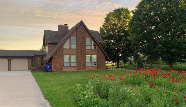 Our Thunder Moon Farm Stay- sleeps 7, framed by wildflowers. 4 miles to GB.