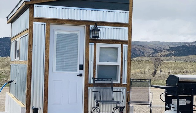 Our tiniest Tiny Home packs a punch! It contains a Queen bed in a loft accessed by a ladder. Sleeps: 2