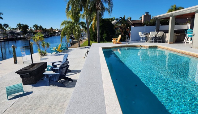 Outdoor lovers dream home- Pool, outdoor kitchen, private dock, and so much more