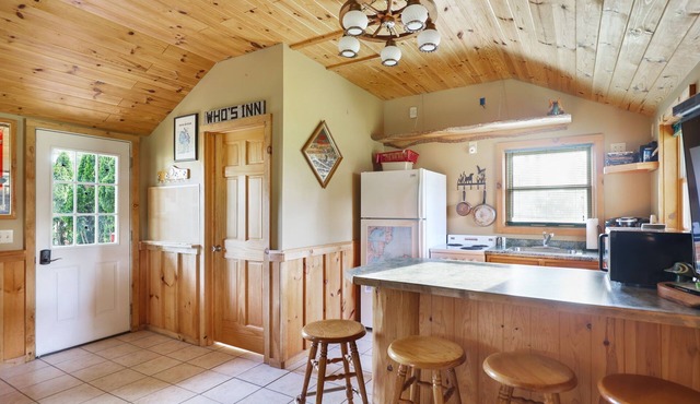 Outdoorsman log cabin near the bay.