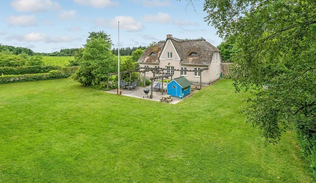 Outside Krusau welcomes you this beautiful thatched house.