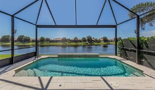 Outstanding Lake View and your own pool, 2 bedroom,2 bath plus den